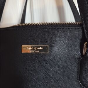 Kate Spade Large Black Bag Features Several Interior Compartments